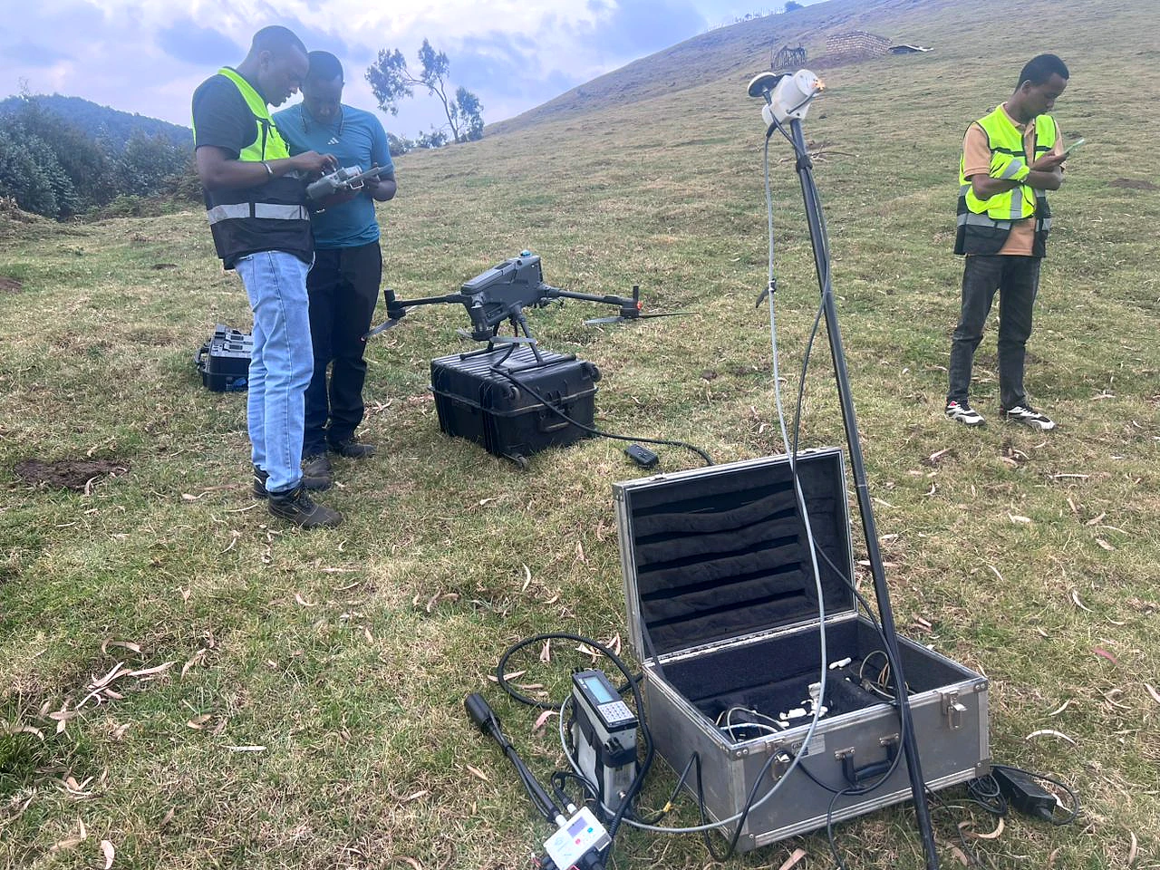 Field crew carrying out positioning and equipment checks at Kabaya