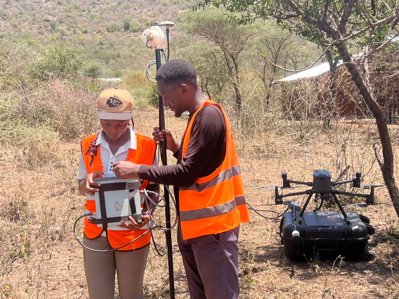 GeoResolve field crew preparing drone magnetic survey equipment in the Elgon Mountain ranges, Kween